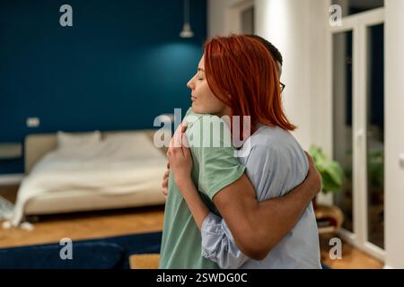 Handsome girl hugs man. Wife comforts husband in difficult moment. Friends and couples relationship Stock Photo