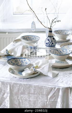 Easter table setting with empty craft ceramic tableware Stock Photo