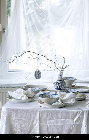Easter table setting with empty craft ceramic tableware Stock Photo