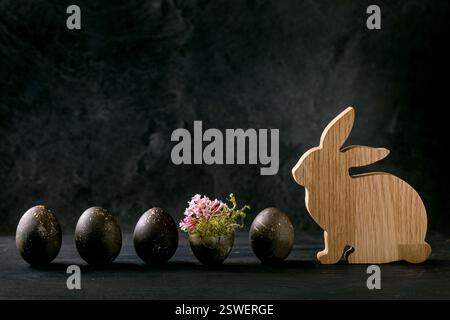 Bio colored black eggs with golden spots Stock Photo