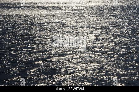 Sunbeams reflect glittering on water surface with high waves, Abstract background, Graphic elements, Mondsee, Salzkammergut, Austria, Europe Stock Photo