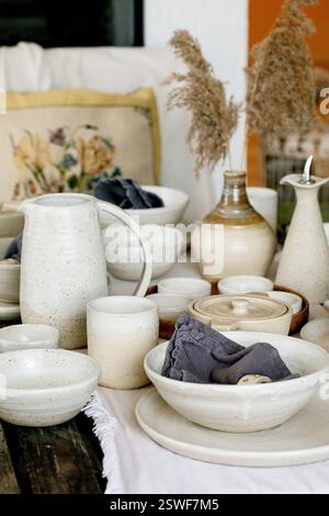 Rustic table setting with empty craft handmade ceramic tableware Stock Photo
