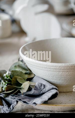 Easter dinner table setting with ceramic tableware Stock Photo