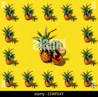 Many pineapples on a solid yellow background pattern Stock Photo