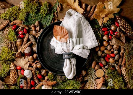 Empty plate over ambiance magic autumnal forest background Stock Photo
