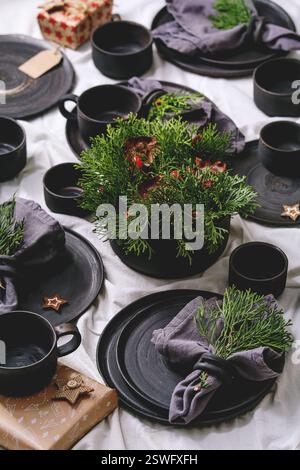 Set of empty black handcrafted ceramic plates Stock Photo