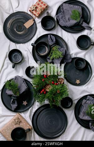 Set of empty black handcrafted ceramic plates Stock Photo