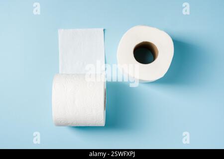 Top view of toilet paper roll on blue background Stock Photo