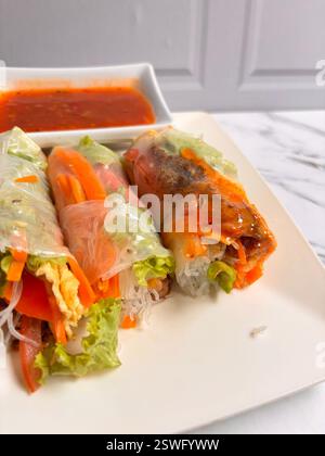 These vibrant salad rolls are a fresh and healthy twist on traditional salads, wrapped in delicate rice paper for a satisfying bite. Packed with crunc Stock Photo