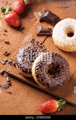 Donuts with fresh strawberries and chocolate Stock Photo