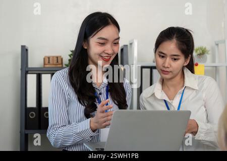 Engaged professionals discussing tax strategies and analysis in a collaborative environment Stock Photo