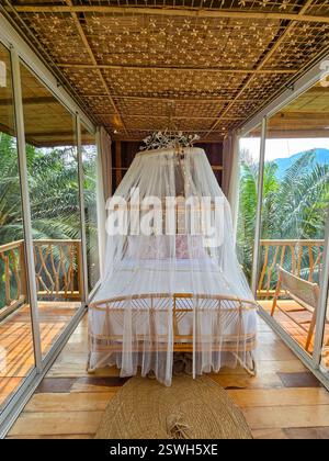 Cozy retreat in a tropical paradise with bamboo decor and natural light Stock Photo