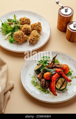 grilled vegetables on plates and falafel Stock Photo