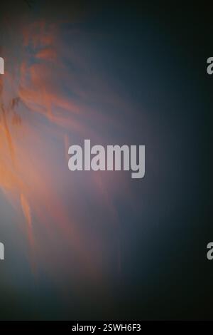 Wisps of Pink Clouds in a Blue Gray Sky Stock Photo