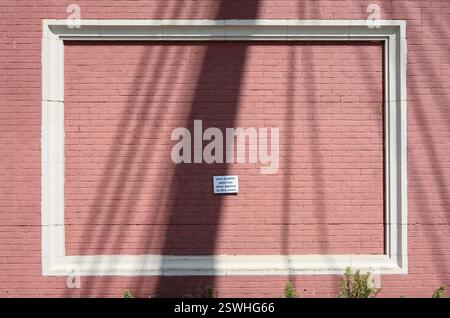 London, UK. 'Anti graffiti paint has been applied to this asset' sign on a bridge across the Thames Stock Photo