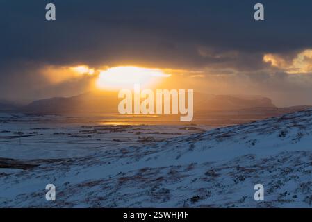 Winter light over snowy landscape, Orkney Islands Stock Photo