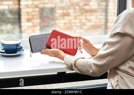Wallet with modern design in elegant hands, perfect for fashion lovers, vibrant style in casual setting, showing creativity as lifestyle accessory, fa Stock Photo