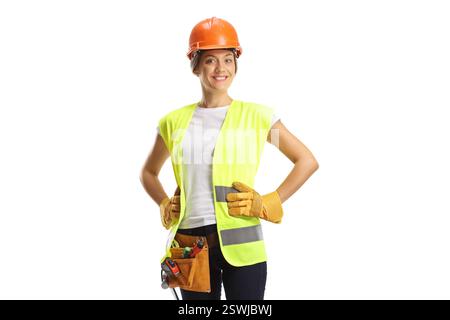Female construction worker wearing a helmet and a tool belt isolated on white background Stock Photo