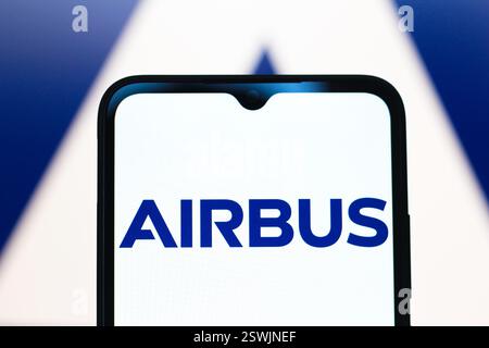 In this photo illustration, the Airbus logo is displayed on the screen ...