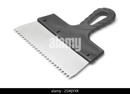 Stainless steel notched spatula with black plastic handle isolated on white Stock Photo
