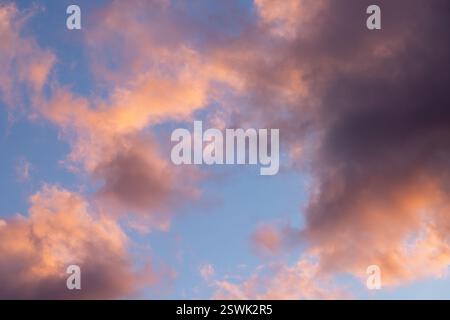 Beautiful pastel colored cloudscape during a vibrant sunset, creating a serene and picturesque view Stock Photo