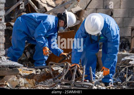 Pacific Palisades, California, USA. 15th Feb, 2025. U.S. Army Sgt. 1st Class Maleina Gomez and Spc. Caleb Kitchens, Chemical, Biological, Radiological, and Nuclear Specialists from the 172nd Chemical Company, 2nd Chemical Battalion, 48th Chemical Brigade, 20th Chemical, Biological, Radiological, Nuclear, Explosives Command, based out of Fort Riley, Kansas, sort through debris at a homesite in Pacific Palisades, California looking for hazardous waste February. 15, 2025. (Credit Image: © Casey Nelsen/U.S. Army/ZUMA Press Wire) EDITORIAL USAGE ONLY! Not for Commercial USAGE! Stock Photo