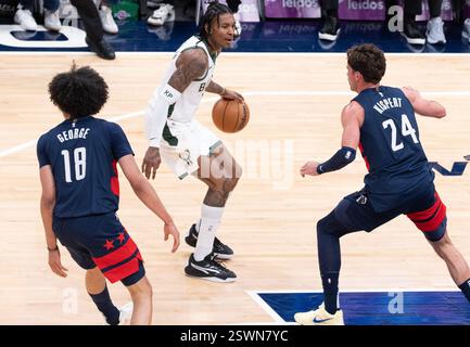 Milwaukee Bucks' Kevin Porter Jr., advances the ball upcourt against ...