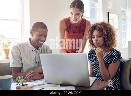 Graphic designers, laptop and people in meeting for discussion, brainstorming and collaboration. Startup, learning and creative strategist in Stock Photo