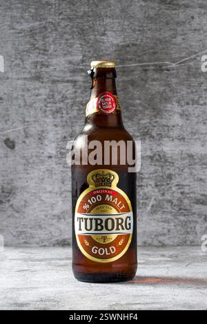 Antalya, Turkey - November 7, 2023: Front view of Tuborg beer bottle on stone background Stock Photo