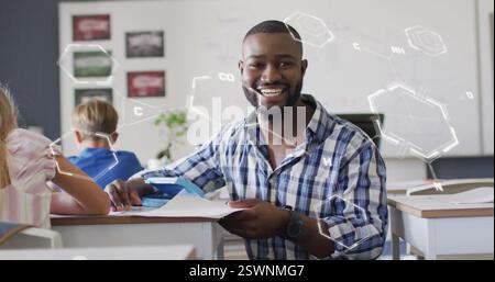 Diverse male teacher and elementary schoolchildren raising hands in ...