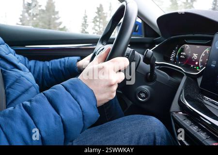 Person or man driving a car close up Stock Photo