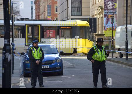 Manchester, UK, 22nd February, 2025. A three-year-old girl has died after a collision between a van and a tram in Manchester city centre, police have confirmed. Greater Manchester Police (GMP) said she was taken to hospital but later died from her injuries. The child was a pedestrian and not in either vehicle.  No arrests have been made. White van involved in the crash on the right. Media report that the police are looking for the driver of the van. Credit: Terry Waller/Alamy Live News Stock Photo
