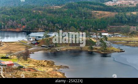 Glen Affric Highland Scotland the Lodge outbuildings and Loch Affric in winter Stock Photo