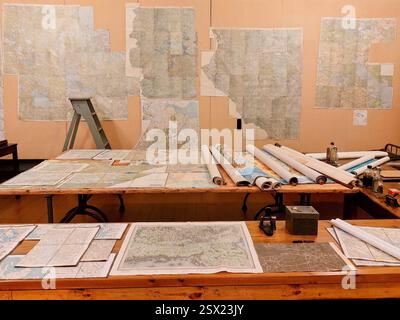 A WWII map room at Mikkeli HQ Museum, Finland, featuring wartime maps, tools, and documents used for military planning. Stock Photo