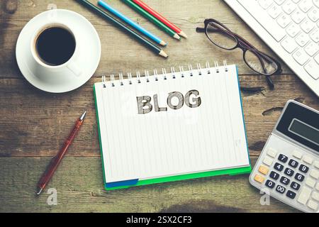 blog word on notepad and keyboard on desktop Stock Photo