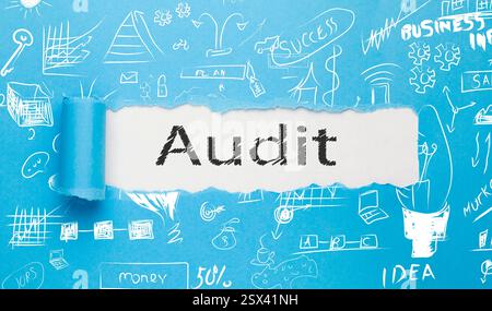 Audit text written paper on blue background Stock Photo