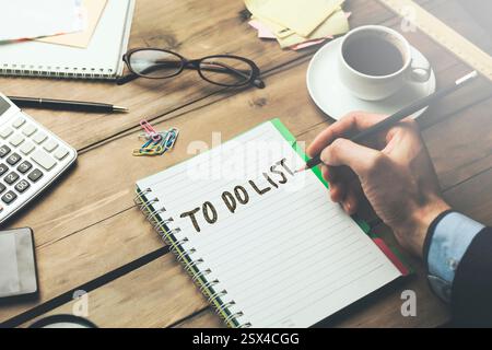 man written to do list text on notebook Stock Photo