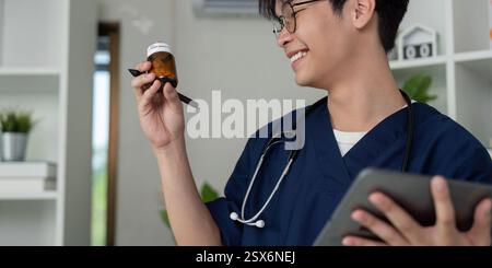 Medical student reviewing prescription medication with a smile, showcasing engagement in healthcare studies. Stock Photo