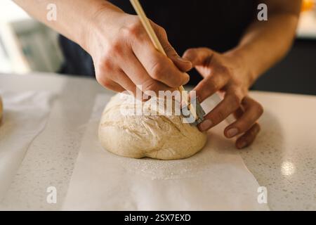 Woman preparing sourdough bread at home Stock Photo