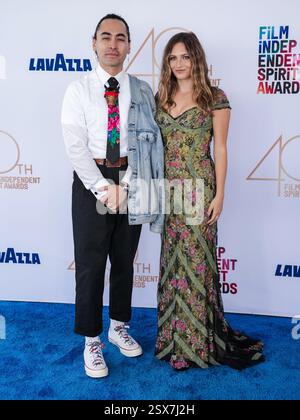 Emily Kassie walking on the red carpet at the The 97th Academy Awards