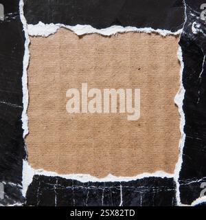Square frame made of torn black paper on cardboard Stock Photo