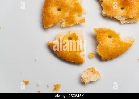 Cracked round crackers on white background Stock Photo