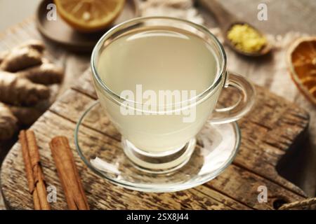 Ginger tea with cinnamon and lemon on a wooden table Stock Photo