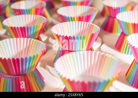 Rainbow colored empty cupcake liners for baking muffin Stock Photo