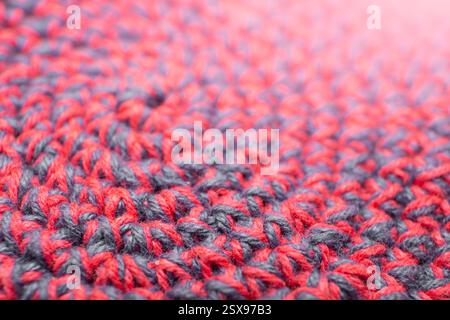 Knitted with a crochet hook, spiral shaped pattern texture, soft focus close up, abstract   backdrop Stock Photo