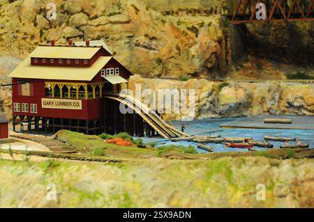 San Diego, California, USA. May 05, 2012: Miniature model of a lumber company with workers and canoes on a realistic landscape. Stock Photo