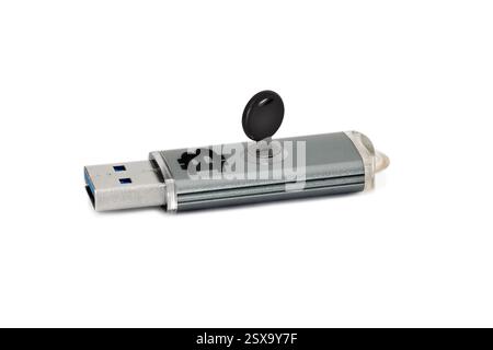 Flash drive with built-in lock ang sign of bitcoin. The concept of security and data security Stock Photo
