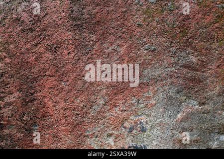 Background texture of wall with old worn pink stucco or cement Stock Photo
