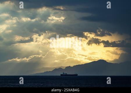 Sun rays in the clouds over Sicily, Tyrrhenian Sea, Italy Stock Photo