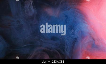Color explosion smoke. Fluid splash vapor. Blue pink ink cloud sparkling paint fume glowing fog texture on abstract art background. Stock Photo